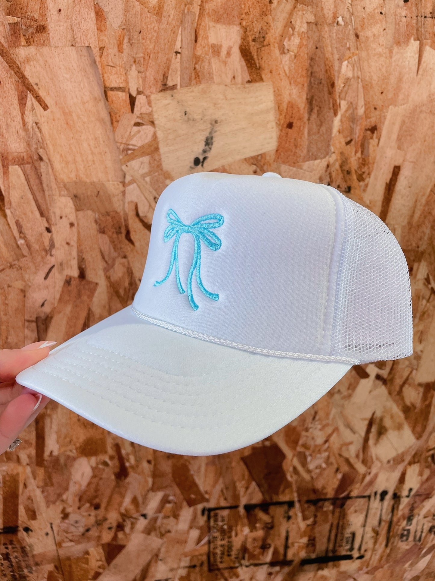 White Trucker Hat: Blue Bow