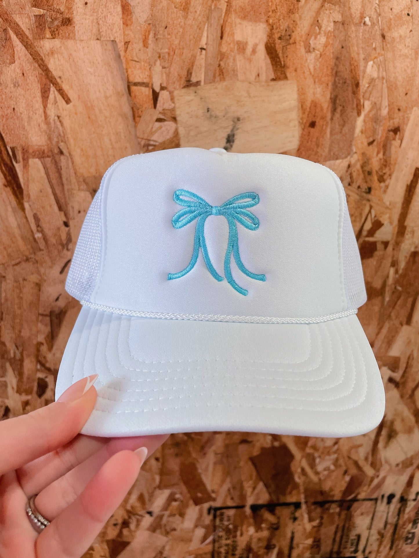 White Trucker Hat: Blue Bow