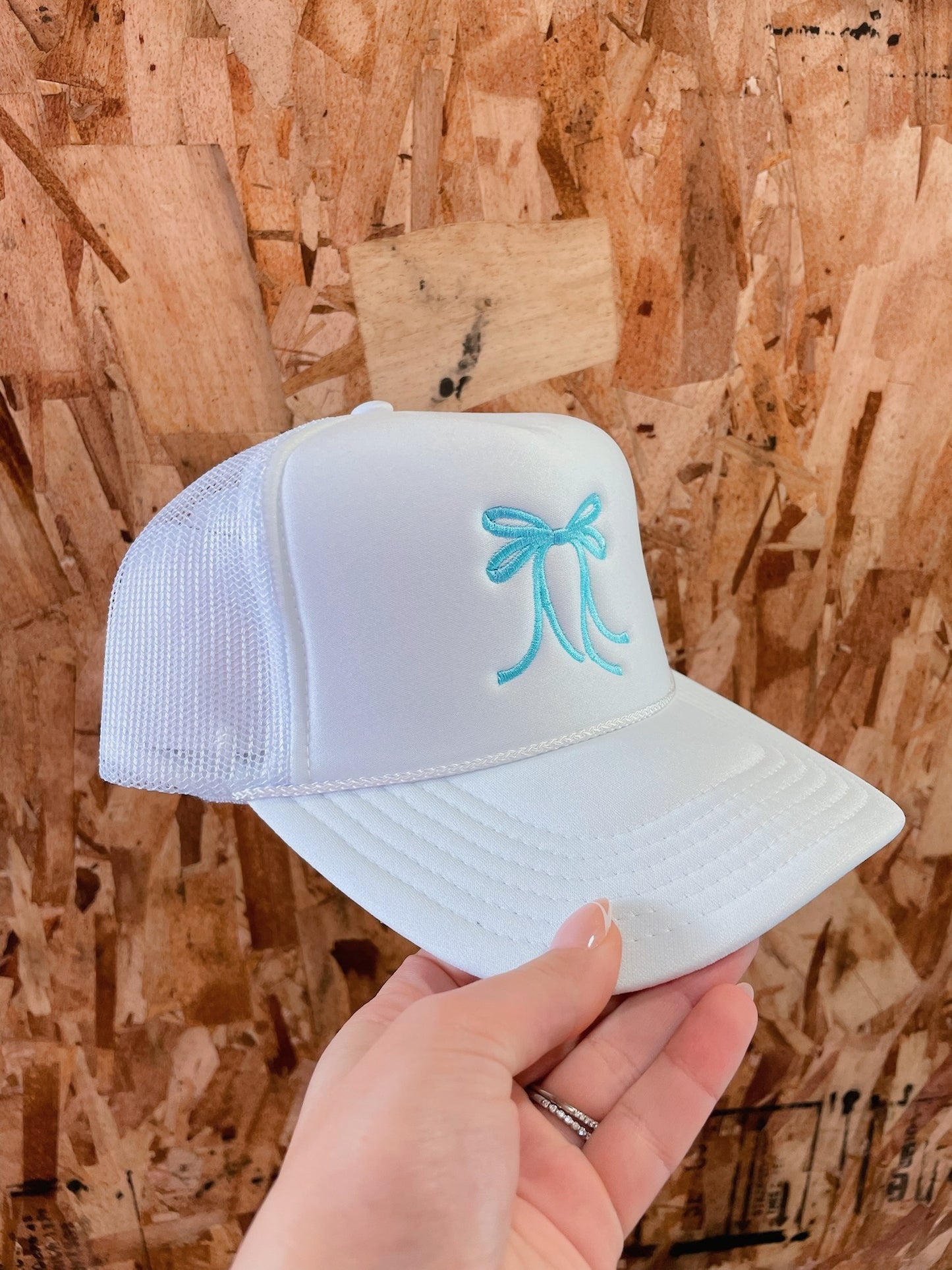 White Trucker Hat: Blue Bow